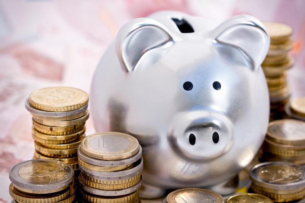 piggy bank surrounded by coins