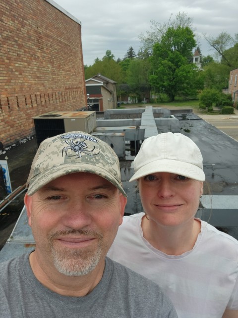 Kevin and Rachel doing roof repairs.